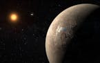 This artist's impression shows the planet Proxima b orbiting the red dwarf star Proxima Centauri, the closest star to the Solar System. Proxima b is a