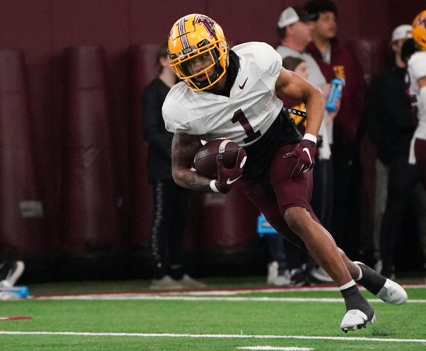 Gophers wide receiver Ike White runs down a pass during an open spring practice inside the Athletes Village football training facility on the campus of the University of Minnesota, Saturday, April 16, 2022 in Minneapolis, Minn. ] SHARI L. GROSS / shari.gross@startribune.com