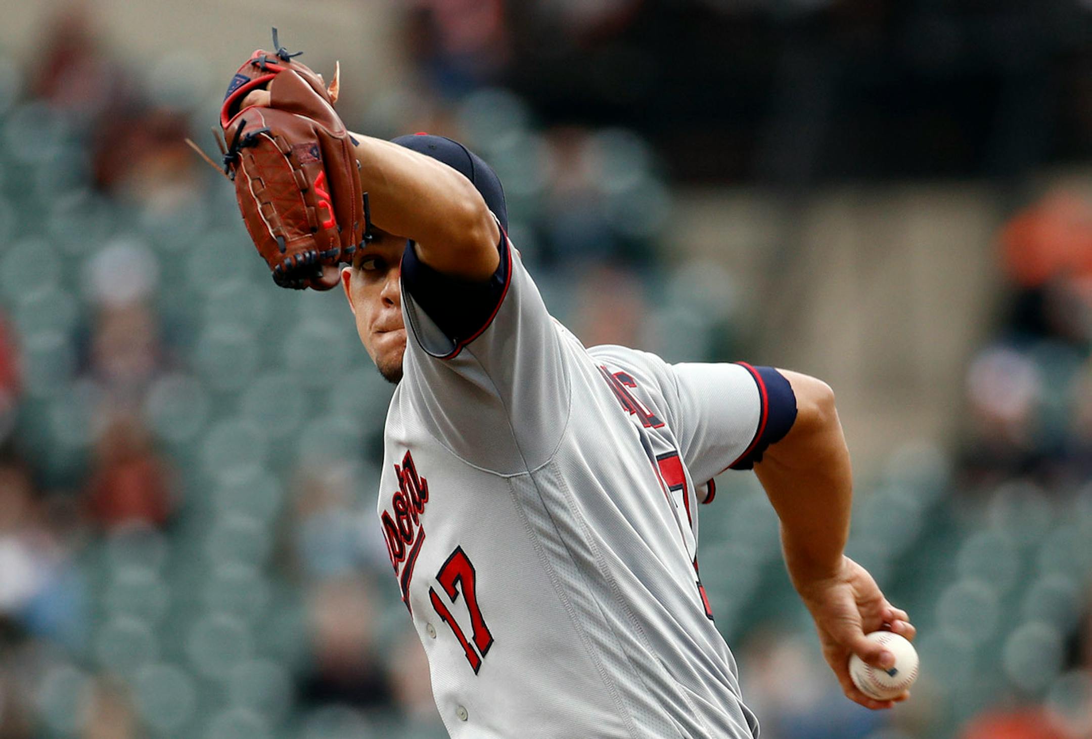 Minnesota Twins starting pitcher Jose Berrios winds up for a pitch to the Baltimore Orioles in the fourth inning of a baseball game, Sunday, April 1, 2018, in Baltimore.