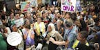 U.S. Rep. Ilhan Omar speaks to supporters after arriving home, at Minneapolis' Saint Paul International Airport, Thursday, July 18, 2019, in Minnesota