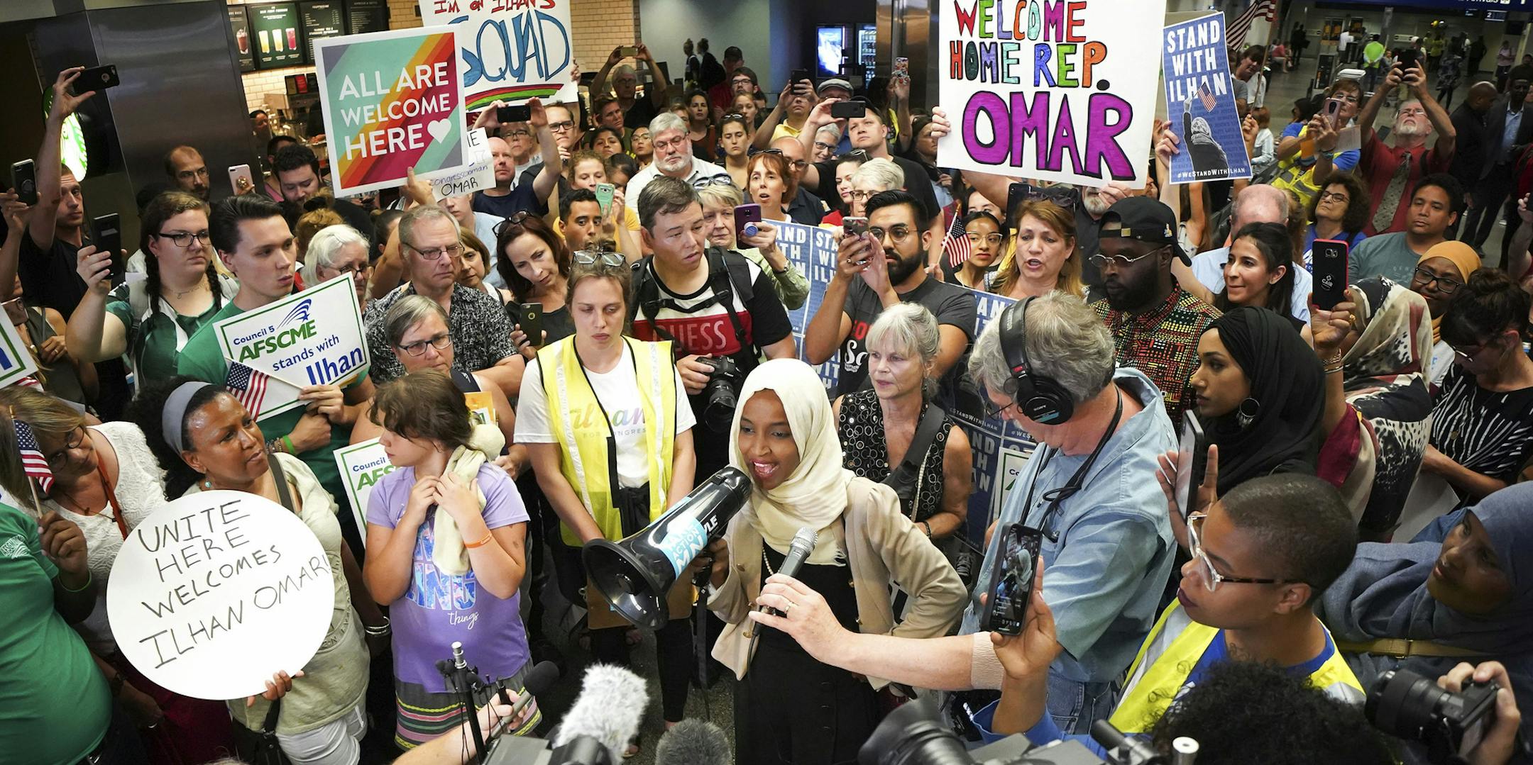 U.S. Rep. Ilhan Omar speaks to supporters after arriving home, at Minneapolis' Saint Paul International Airport, Thursday, July 18, 2019, in Minnesota. President Donald Trump is chiding campaign supporters who'd chanted "send her back" about Somali-born Omar, whose loyalty he's challenged. (Glen Stubbe/Star Tribune/TNS) ORG XMIT: 1365985