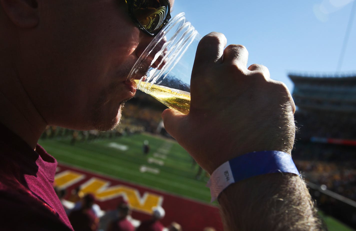 Gophers fan D.J. Anderson of White Bear Lake enjoyed a beer from near the endzone in 2012.