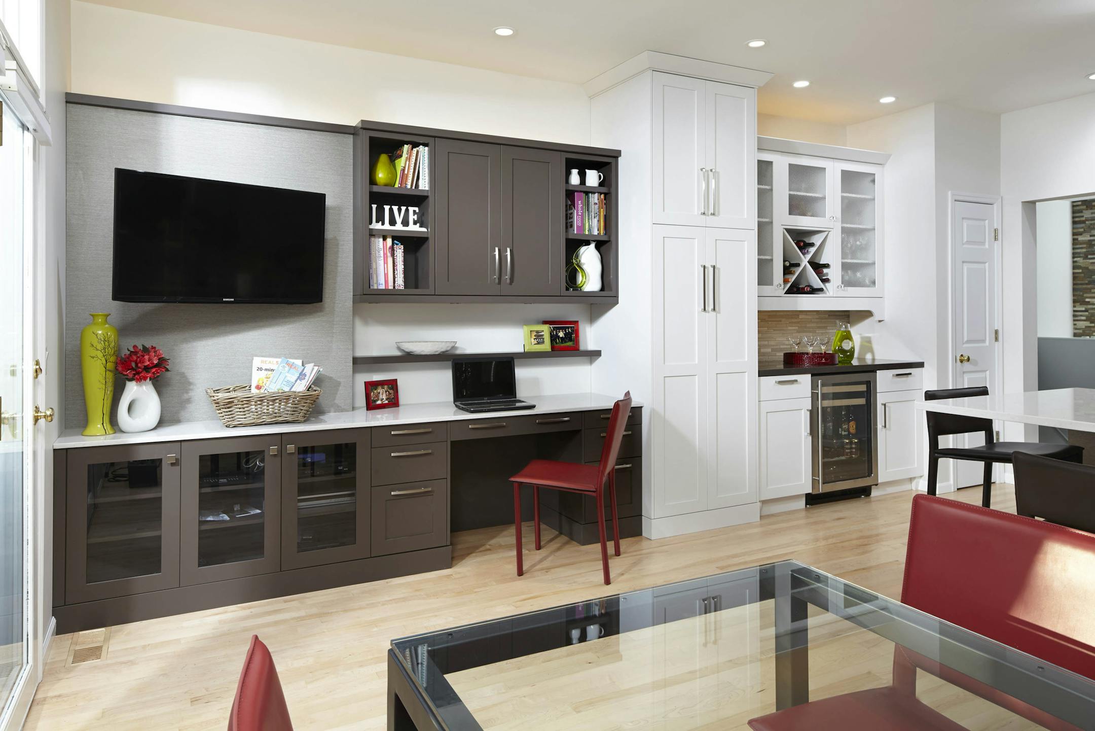 An organization station has a computer desk and TV.