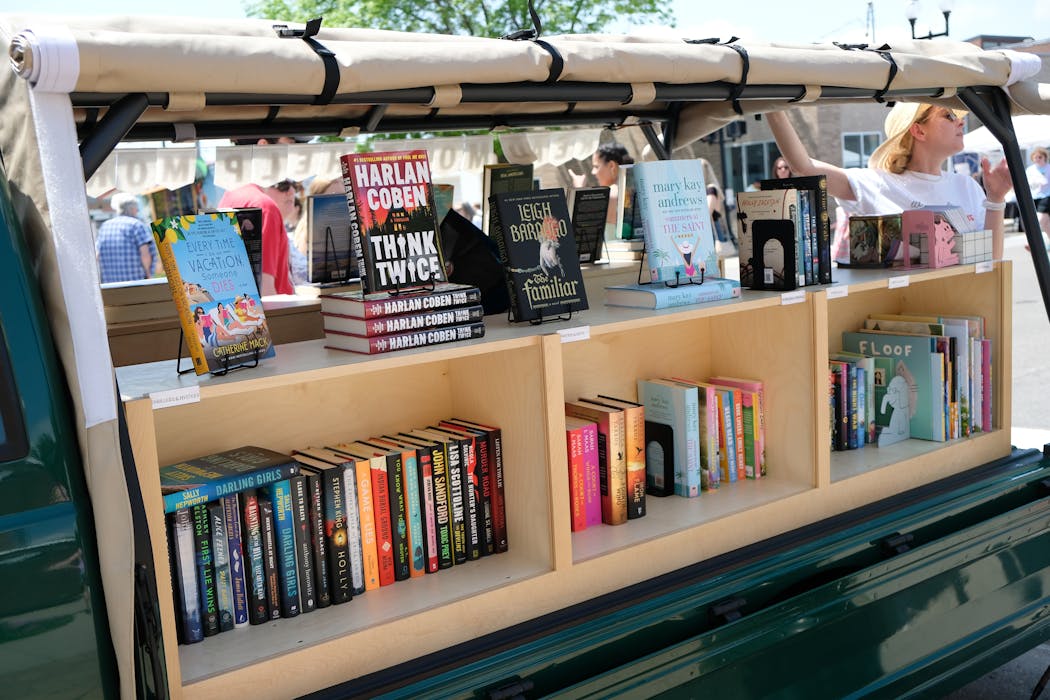 Rachel Cleveland (right) is open for business with the Little Charity Book Truck.