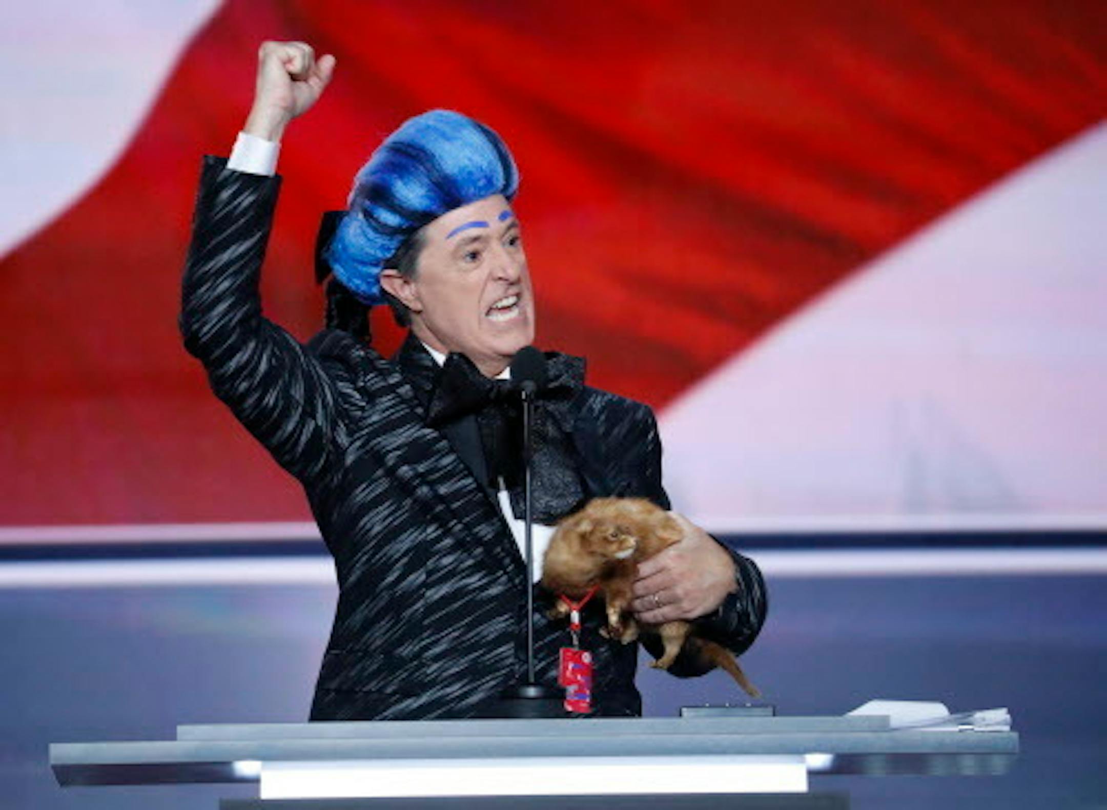 Comedian Stephen Colbert clowns around on the stage at the Republican National Convention in Cleveland, Sunday, July 17, 2016.