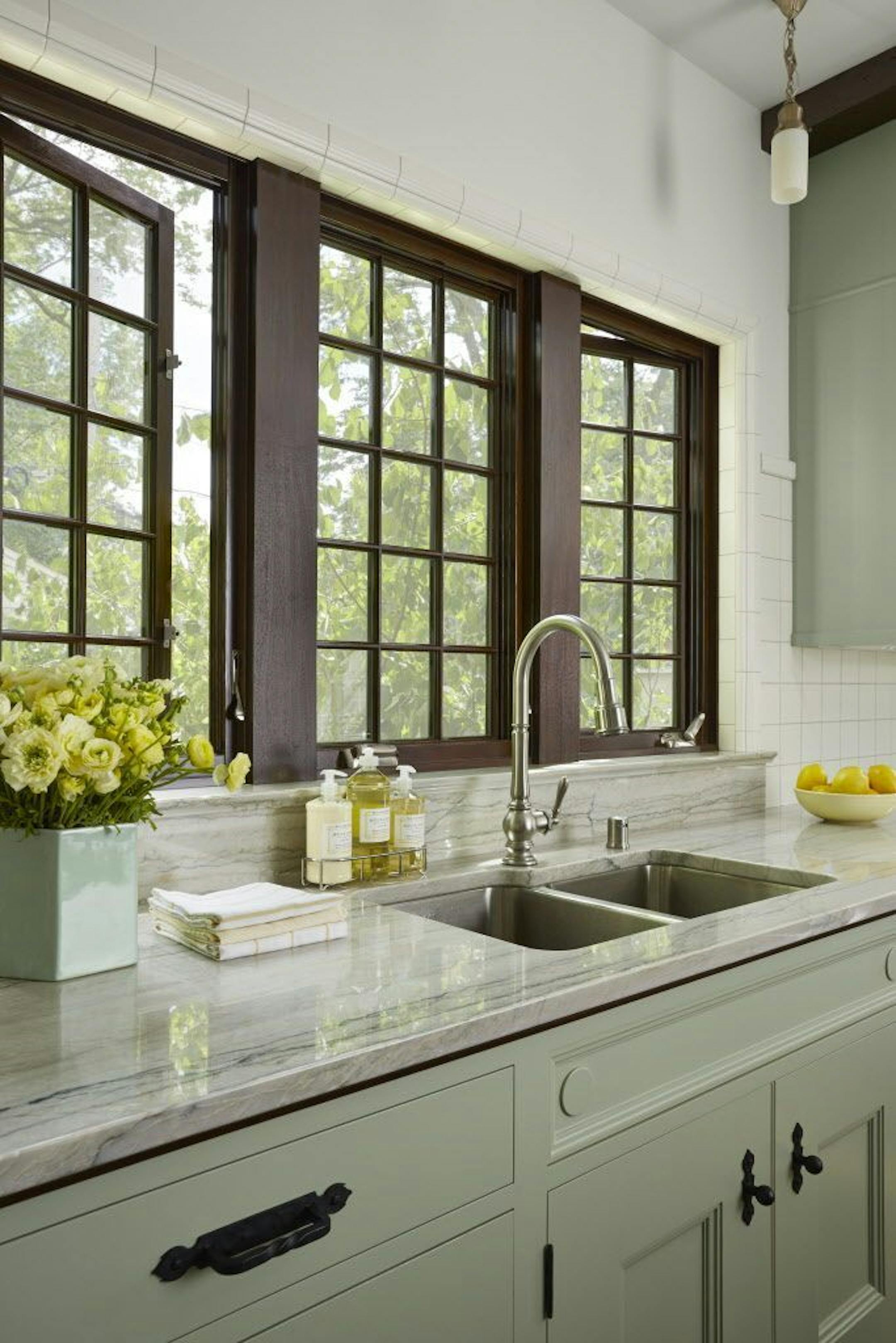 Windows in the new kitchen overlook the backyard.