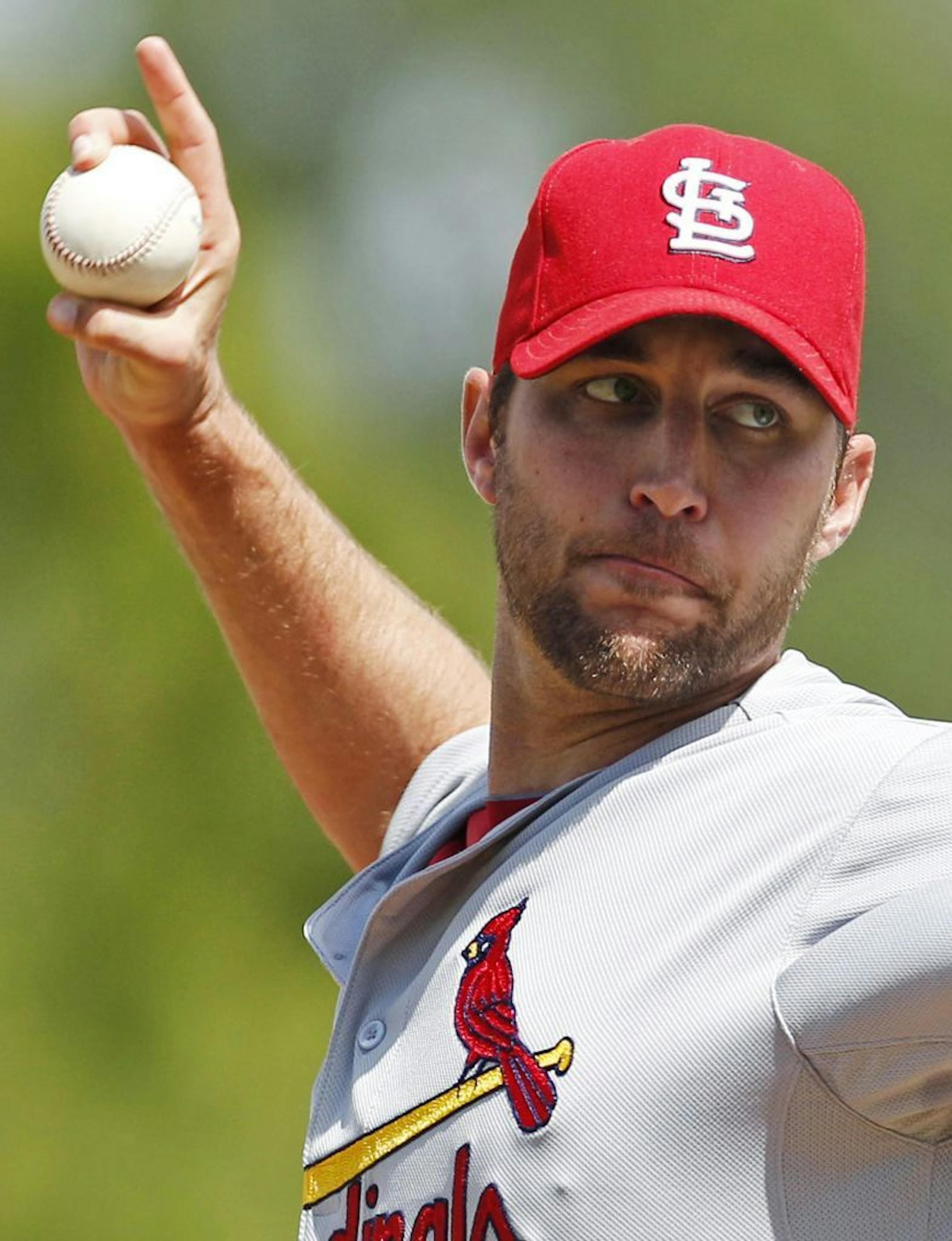 St. Louis Cardinals starter Adam Wainwright delivers to the Minnesota Twins during the second inning of a spring training baseball game in Fort Myers, Fla., Friday, March 9, 2012. Wainwright, pitching in his first start since reconstructive elbow surgery last year, gave up no runs, no hits and struck out two in his two-inning outing.