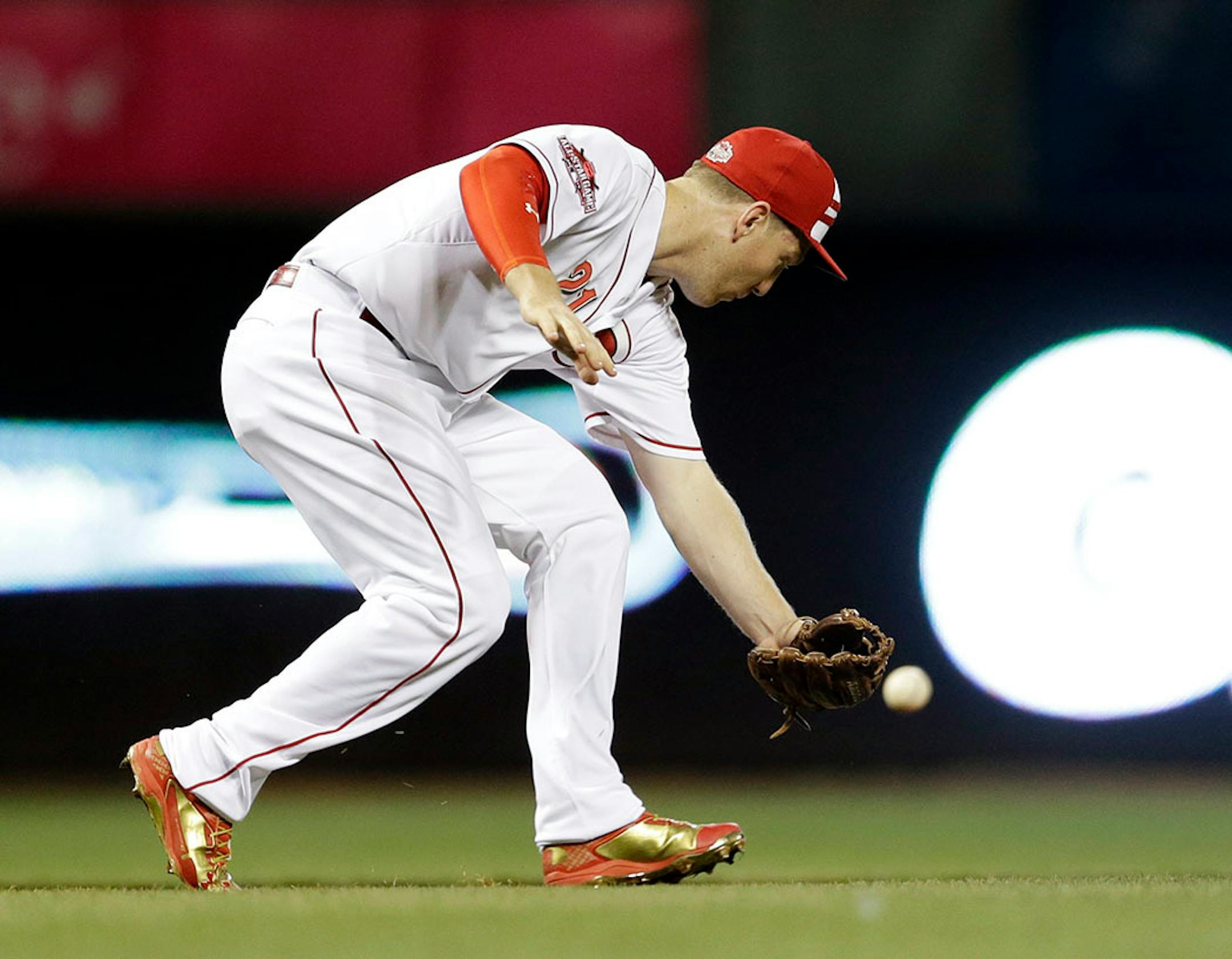 National League's Todd Frazier, of the Cincinnati Reds, cannot make a catch on a ball hit by American League's Alcides Escobar, of the Kansas City Royals, during the fifth inning of the MLB All-Star baseball game, Tuesday, July 14, 2015, in Cincinnati.