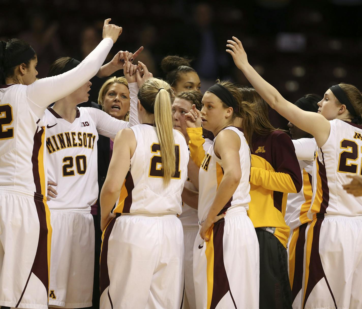 The Gophers gathered for a timeout moments after they pulled ahead of Green Bay on Rachel Banham's three pointer Wednesday night.