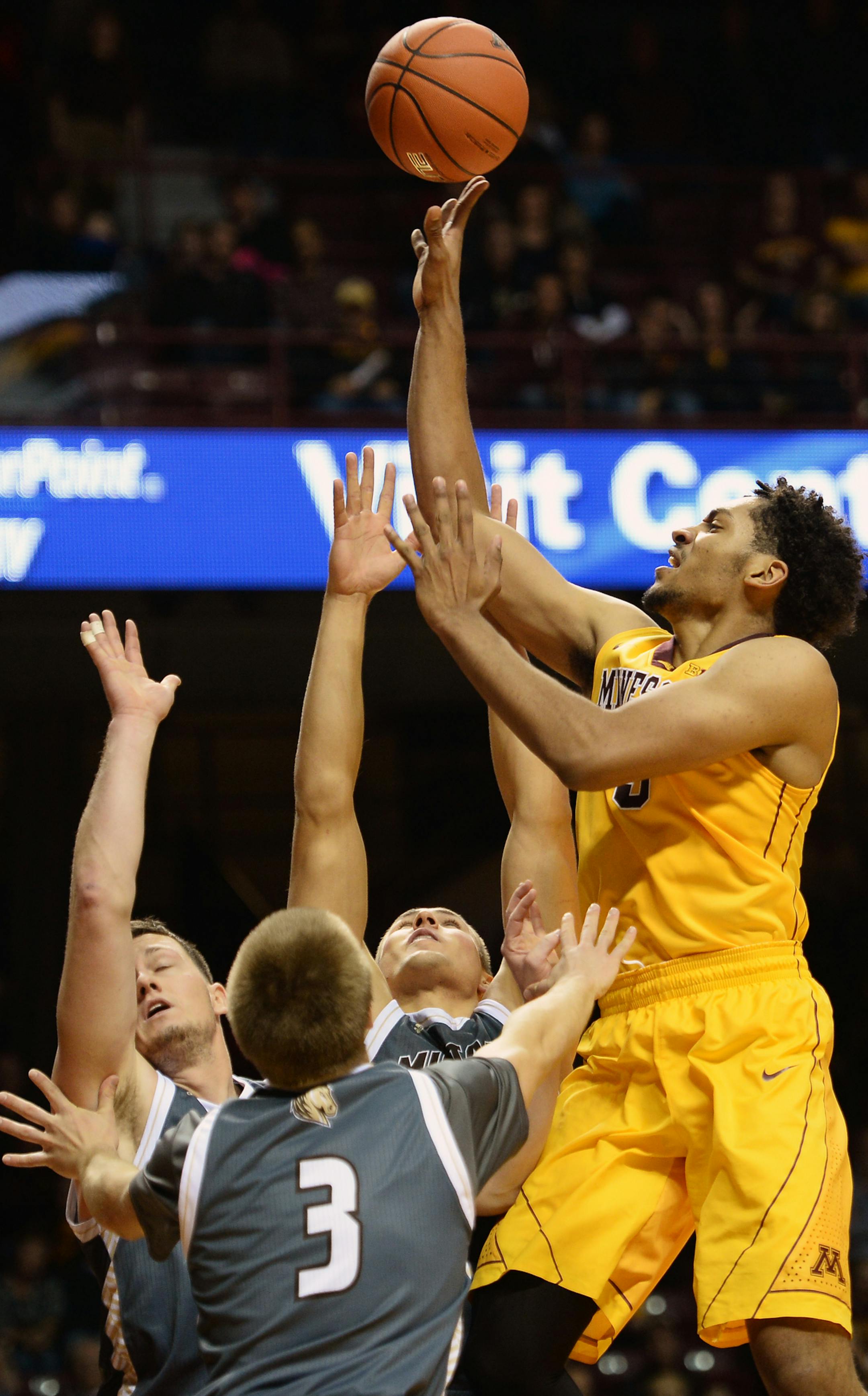 Minnesota Golden Gophers forward Jordan Murphy (3) hit a 2-point shot over Southwest Minnesota State defenders in the second half. ] (AARON LAVINSKY/STAR TRIBUNE) aaron.lavinsky@startribune.com The University of Minnesota Gophers mens' basketball team played the Southwest Minnesota State Mustangs on Friday, Nov. 6, 2015 at Williams Arena in Minneapolis, Minn.