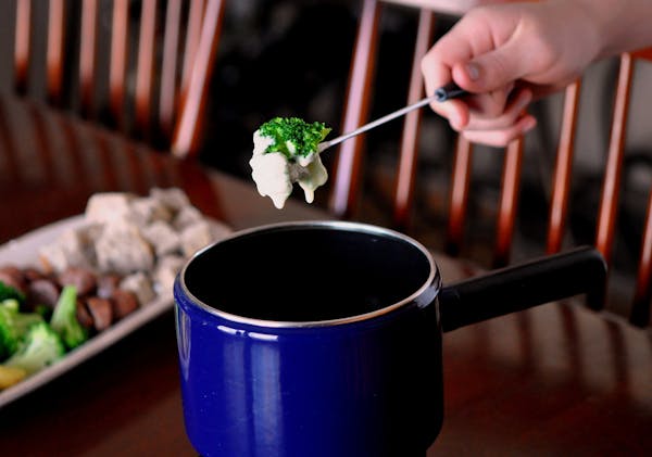 Cheese fondue is delicious with a variety of dippers, including cubes of whole-grain bread, vegetables and bite-sized pieces of meat.
