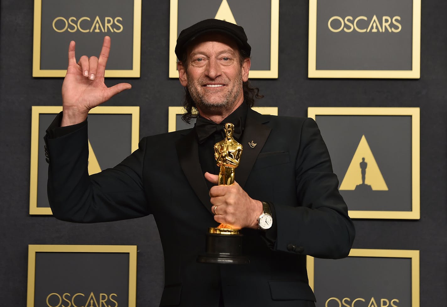 Troy Kotsur, winner of the award for best performance by an actor in a supporting role for "CODA," poses in the press room at the Oscars on Sunday, March 27, 2022, at the Dolby Theatre in Los Angeles. (Photo by Jordan Strauss/Invision/AP)