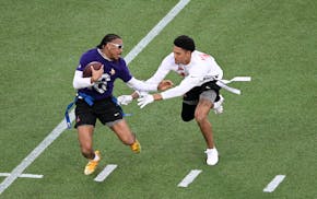 Vikings receiver Justin Jefferson, left, tries to elude Ravens safety Kyle during the Pro Bowl flag football game in February.