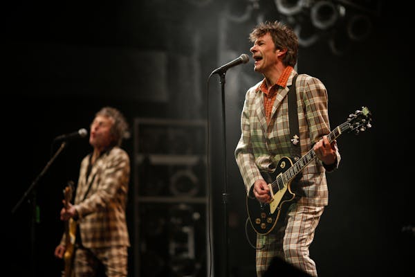 Tommy Stinson, left, and Paul Westerberg of The Replacements during their set at Midway Stadium Saturday evening. ] JEFF WHEELER • jeff.wheeler@star