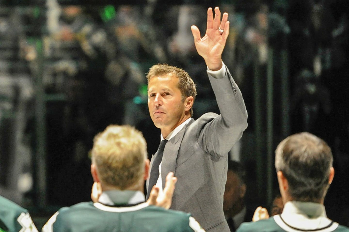 Mike Modano, who played 20 years for the Dallas Stars' franchise, waves to the crowd as he's introduced during a ceremony to retire his No. 9 jersey at American Airlines Center in Dallas, Texas, on Saturday, March 8, 2014. (Michael Prengler/Fort Worth Star-Telegram/MCT) ORG XMIT: 1150142