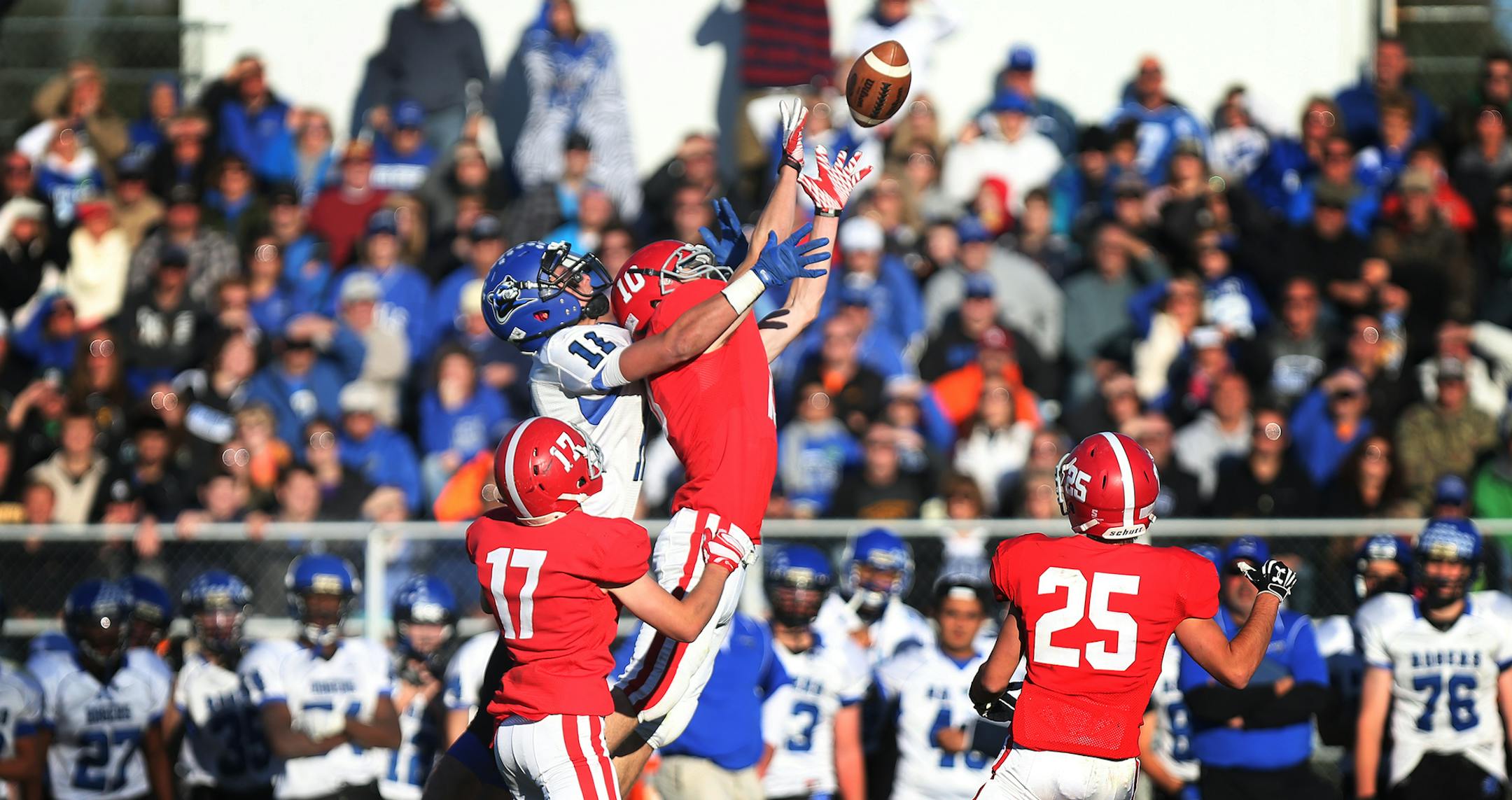 Alec Hills of Elk River intercepts a pass intended for Lance Lendl of Rogers during their playoff game at Elk River High School. ] LEILA NAVIDI leila.navidi@startribune.com / BACKGROUND INFORMATION: Elk River and Rogers High School faced off in a playoff game at Elk River High School in Elk River, Minn. on Saturday, October 25, 2014.