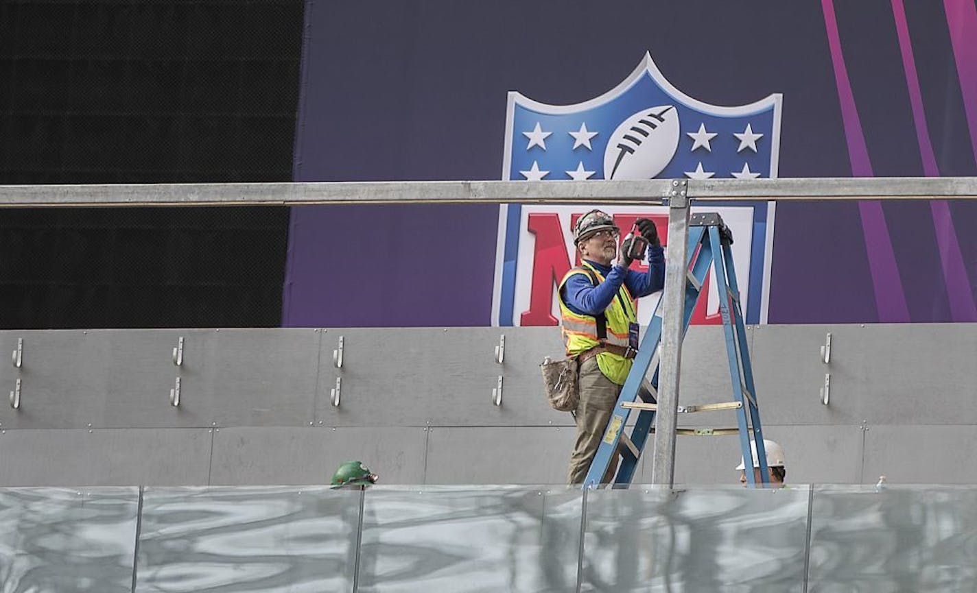 Crew worked on the field as NFL Senior Director of Events Eric Finkelstein and NFL Field Director Ed Mangan spoke to the media about field preparations for Super Bowl LII during a press conference inside US Bank Stadium, Tuesday, January 23, 2018 in Minneapolis, MN.