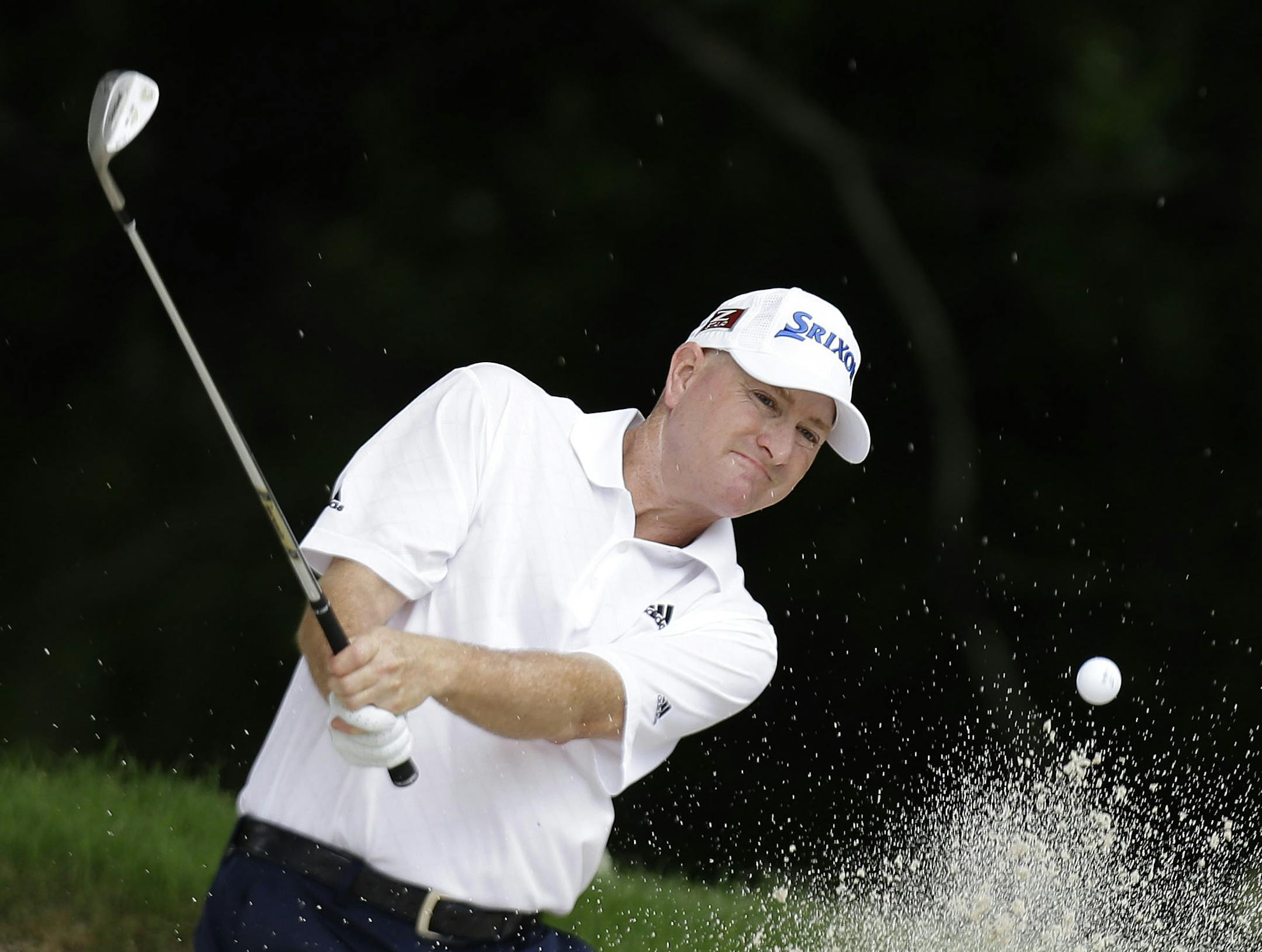 Steve Flesch hits from the sand during the final round of the Colonial golf tournament Sunday, May 25, 2013, in Fort Worth, Texas. (AP Photo/LM Otero) ORG XMIT: OTK