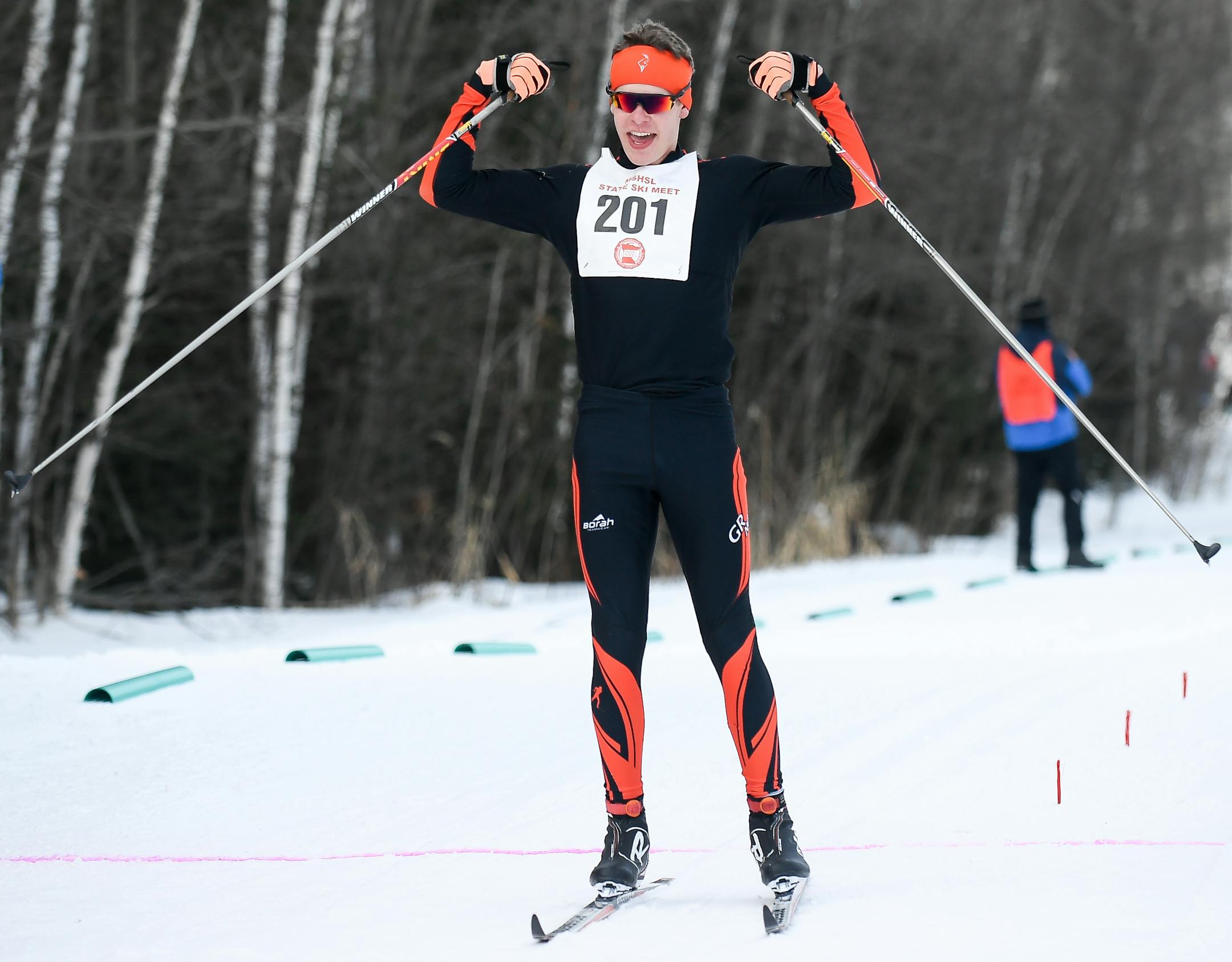 Grand Rapids' Garrett Beckrich celebrated after finishing first in the 5k classic race Thursday in Biwabik. (Aaron Lavinsky, Star Tribune)