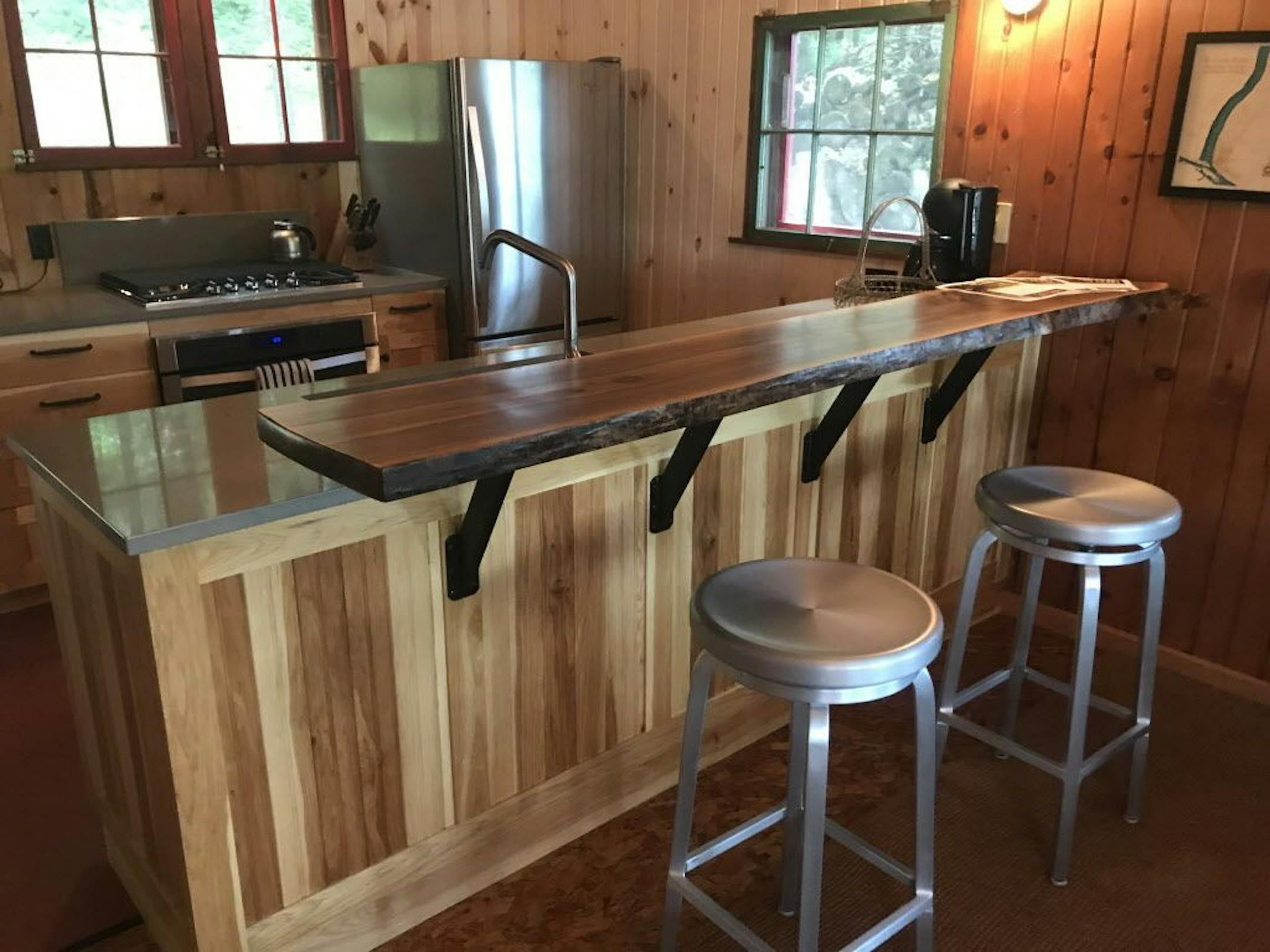 The kitchen has a new walnut bar.