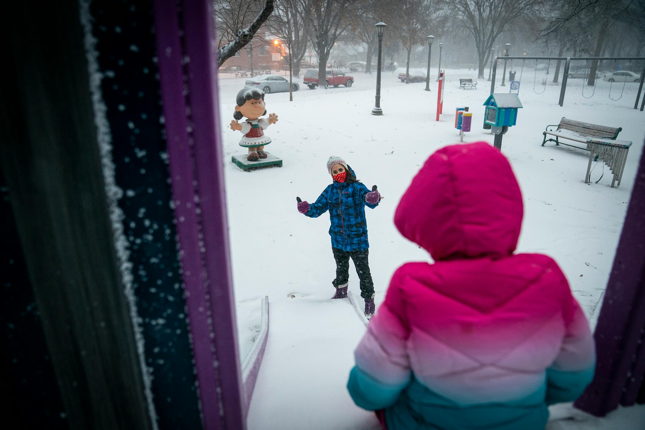 Katherine DuBois of St. Paul braved the blizzard weather with her foster child to play at Boyd Park in St. Paul during a major winter storm.