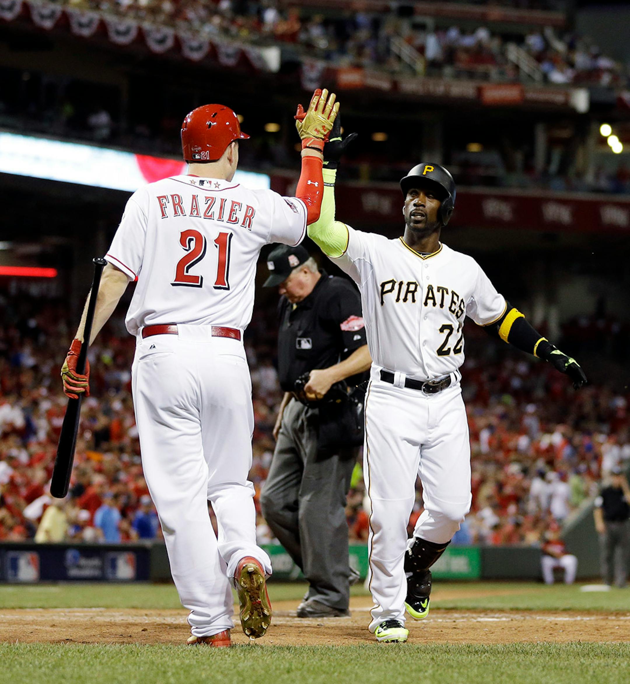 National League's Andrew McCutchen, of the Pittsburgh Pirates, is congratulated by National League's Todd Frazier, of the Cincinnati Reds, after hitting a home run during the sixth inning of the MLB All-Star baseball game, Tuesday, July 14, 2015, in Cincinnati.