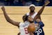 Josh Okogie (20) of the Minnesota Timberwolves was fouled by Serge Ibaka (9) of the Los Angeles Clippers in the first quarter.