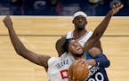 Josh Okogie (20) of the Minnesota Timberwolves was fouled by Serge Ibaka (9) of the Los Angeles Clippers in the first quarter.
