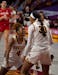 Minnesota Gophers guard Jasmine Powell (4) celebrated with Minnesota Gophers forward Kadiatou Sissoko (30) after she was fouled shooting in the second