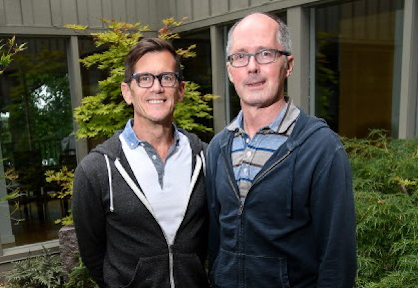 Michael Olafson and Gary Bennett in the redone atrium of their Minneapolis home.