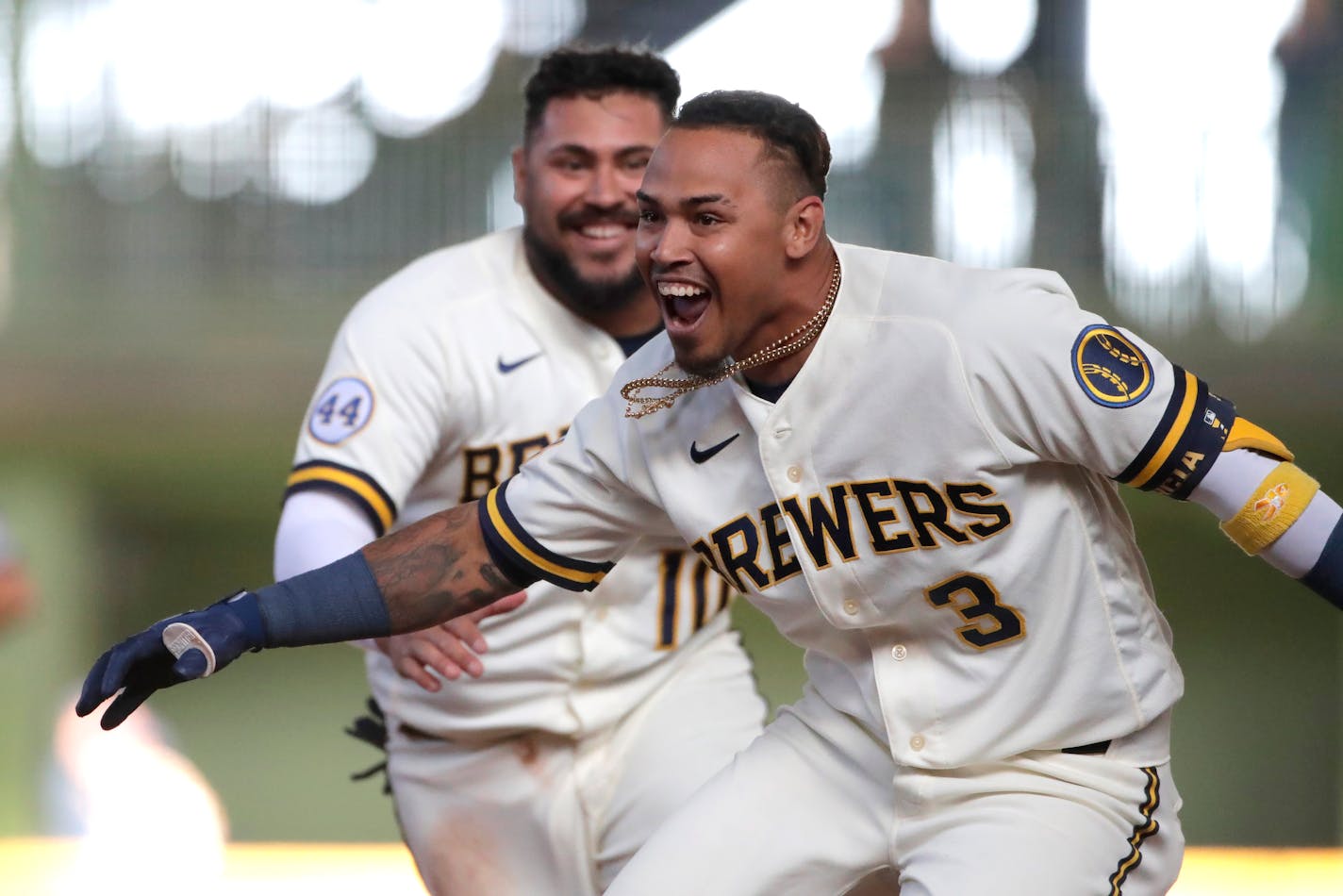 Milwaukee's Orlando Arcia celebrates with teammates after driving in the winning run during the 10th inning of the team's Opening Day game against the Twins