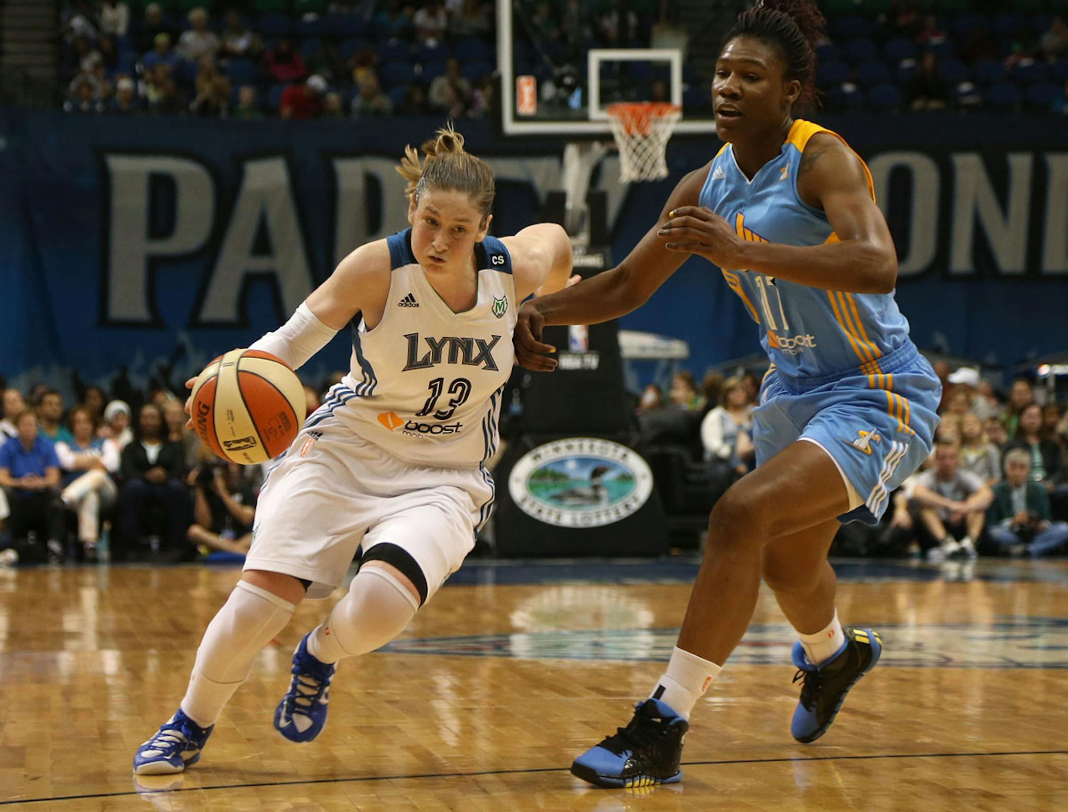 Lindsay Whalen cut to the basket as she went by the Sky's Avery Warley on September 14, 2013