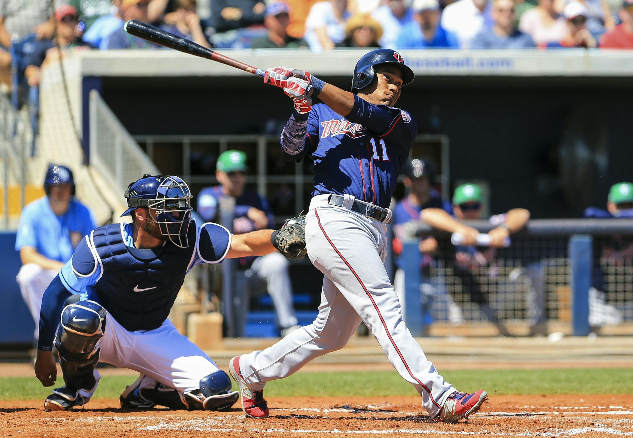 Minnesota Twins shortstop Jorge Polanco (11) connects for a solo home run in the second inning of a spring training baseball game against the Tampa Bay Rays in Port Charlotte, Fla., on Friday, March 17, 2017. (Will Vragovic /Tampa Bay Times via AP)
