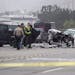 Los Angeles County Sheriff's deputies investigate the scene of a collision involving three vehicles in Malibu, Calif. on Saturday, Feb. 7, 2015. Offic