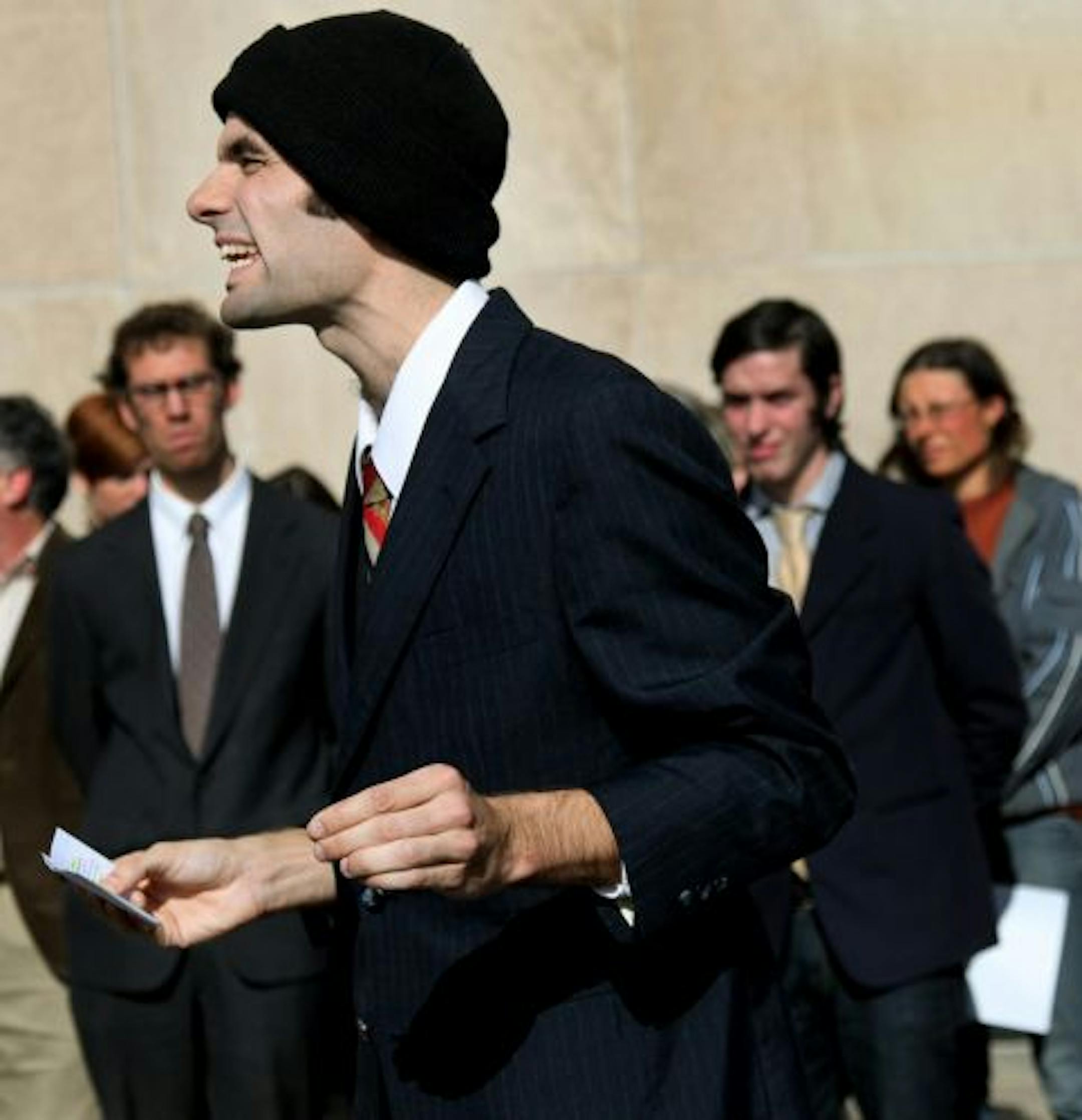 Garrett Fitzgerald shouted angrily outside the Ramsey County Courthouse after he pleaded guilty to conspiracy to commit criminal damage to property during the Republican National Convention. Other defendants were David McKay, left, and Max Specktor, right.