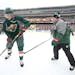 Minnesota Wild Head Coach John Torchetti took to the ice alongside Charlie Coyle for a practice before the 2016 Stadium Series Alumni game at TCF Bank