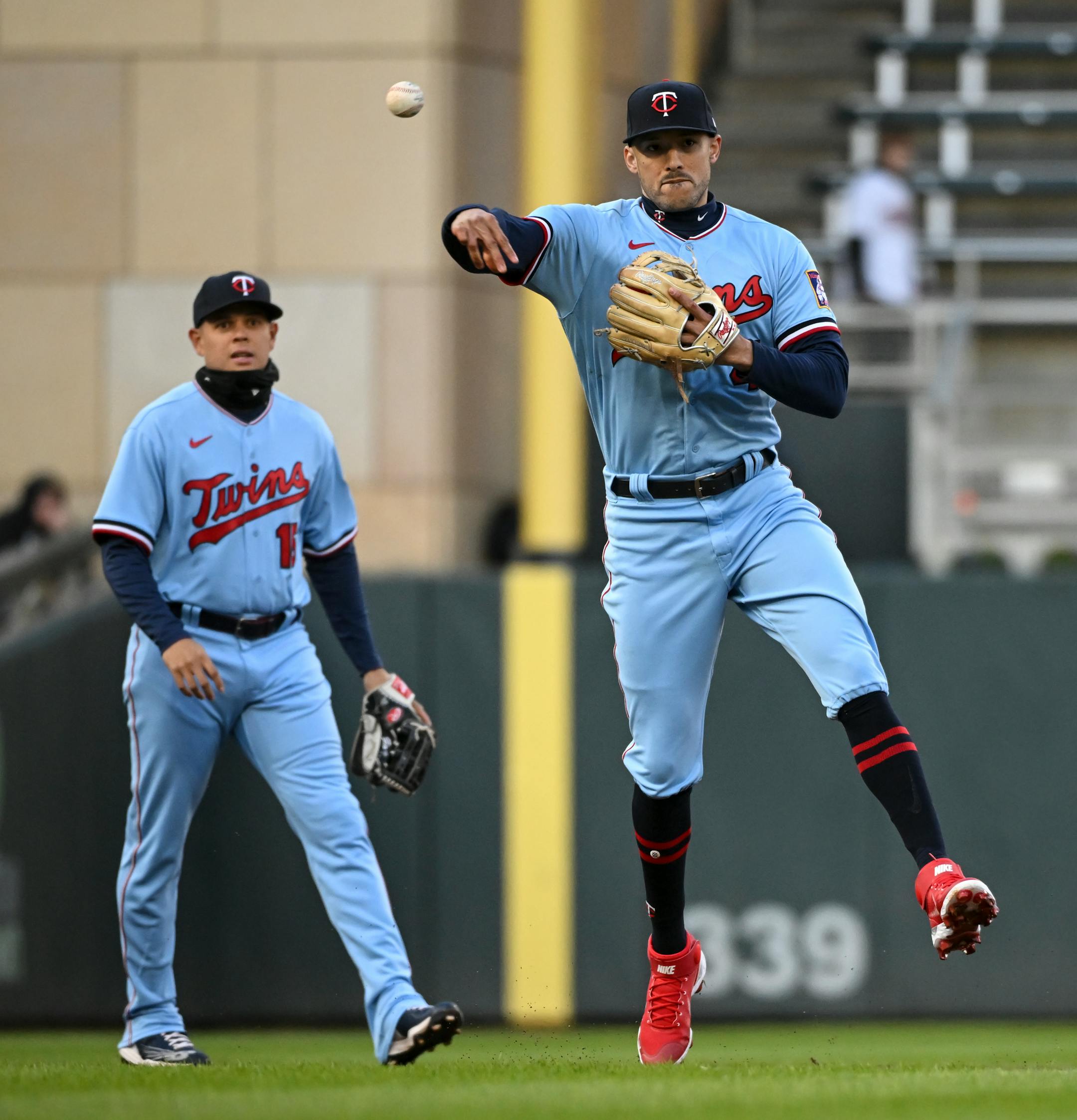 Minnesota Twins shortstop Carlos Correa (4) throws Detroit Tigers second baseman Jonathan Schoop (7) out at first to end the top of the second inning.