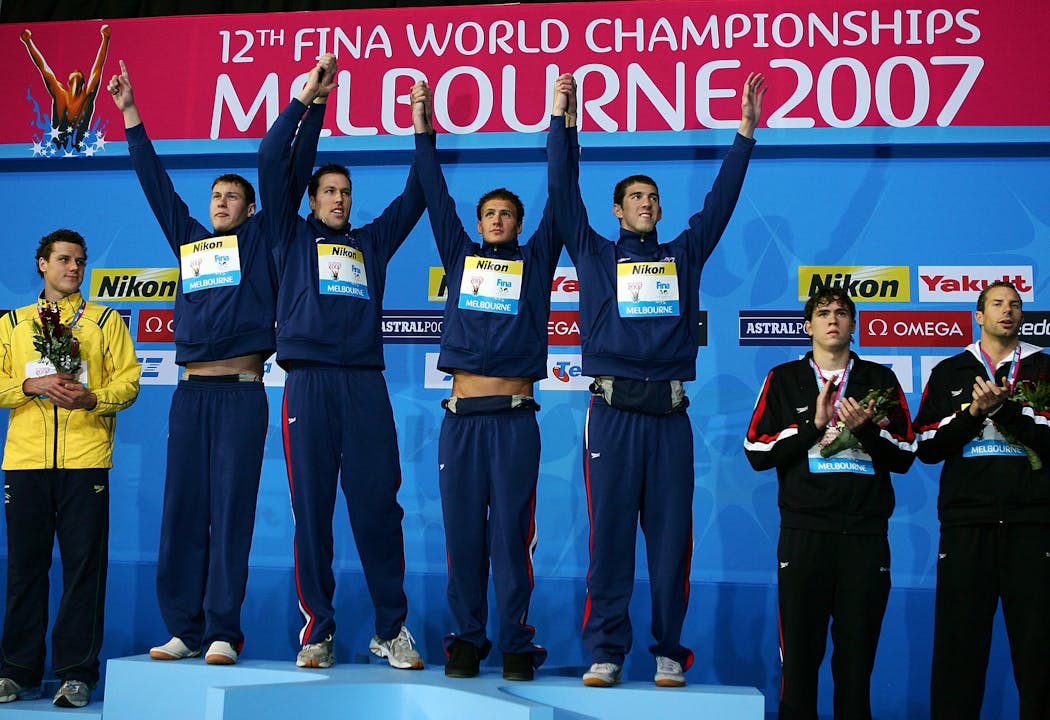 Peter Vanderkaay, Klete Keller, Ryan Lochte and Michael Phelps pose following a victory and a world record performance in Australia in 2007.