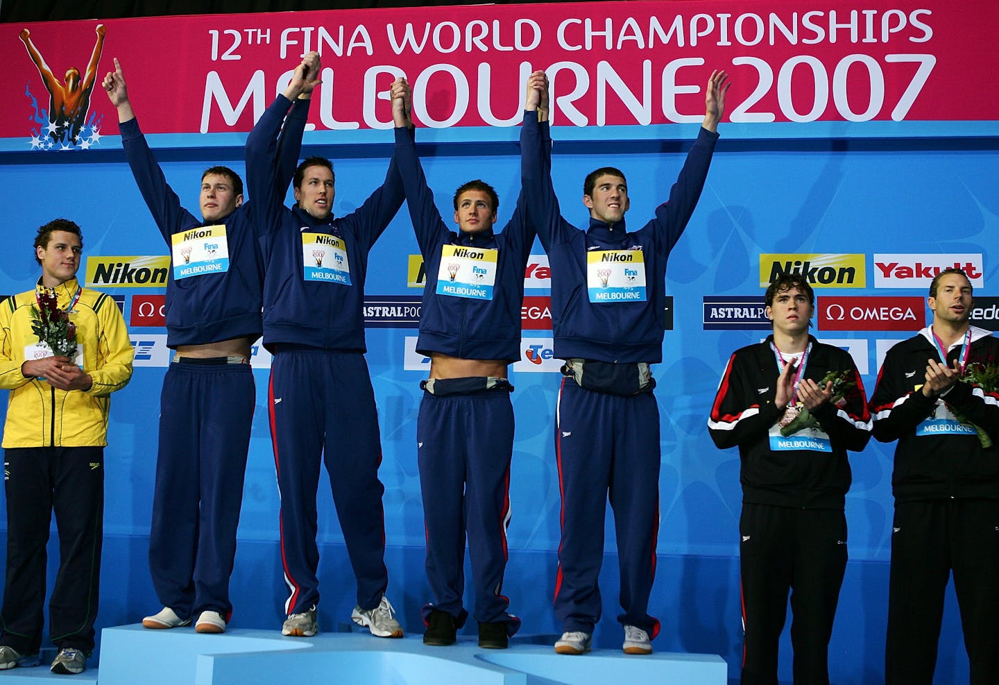 (From left) Peter Vanderkaay, Klete Keller, Ryan Lochte and Michael Phelps of the USA pose following the victory and a world record in the Men's 4 x 200m Freestyle Final during the XII FINA World Championships at the Rod Laver Arena on March 30, 2007, in Melbourne, Australia. (Mark Dadswell/Getty Images/TNS) ORG XMIT: 5984792W