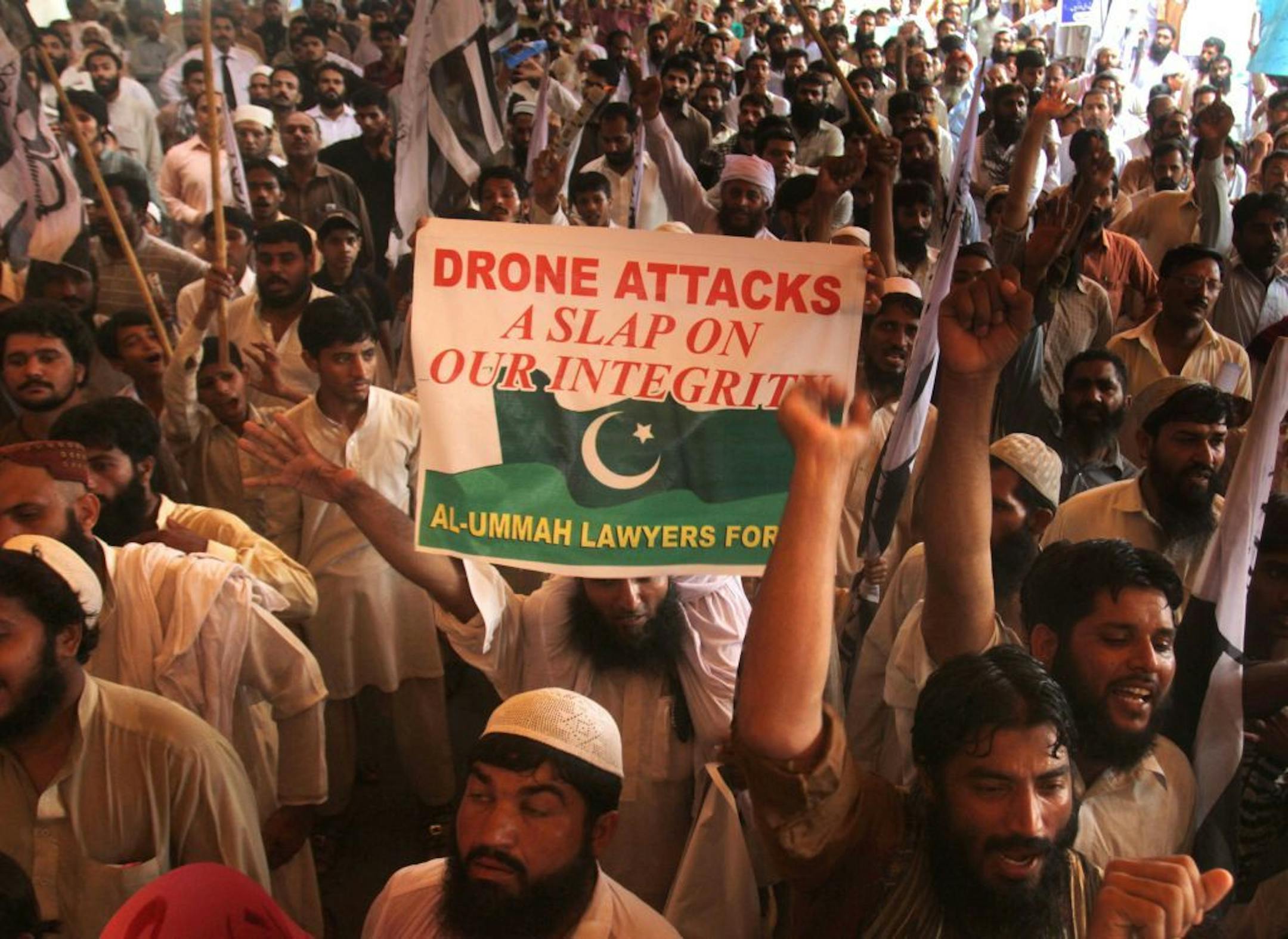 FILE --This July 5, 2013 file photo shows supporters Pakistan's religious party rally to condemn US drone attacks on militants' hideouts in Pakistani border area of Waziristan, in Lahore, Pakistan.