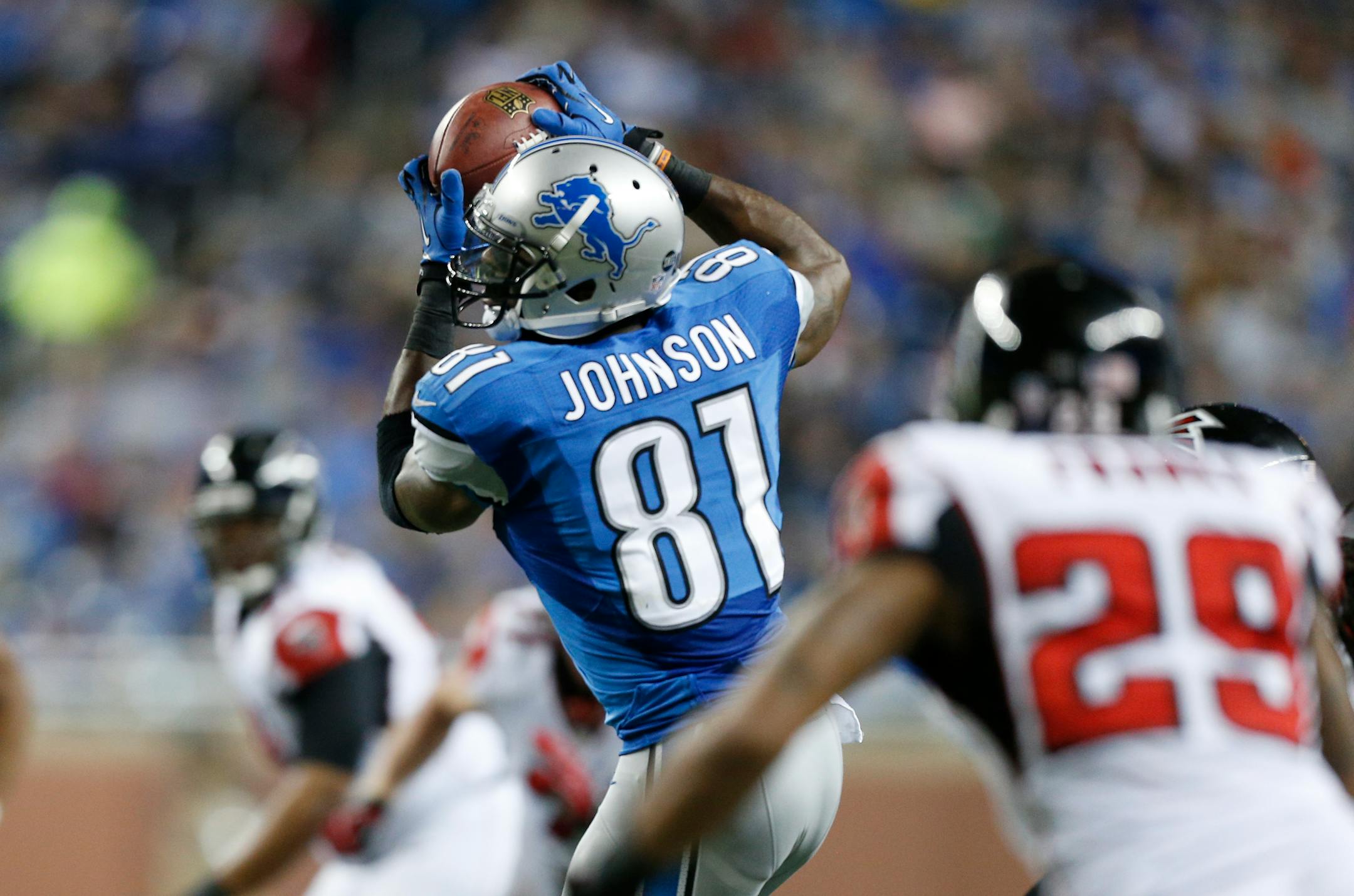 Detroit Lions wide receiver Calvin Johnson (81) caught a pass during the first half of Saturday night's game against Atlanta. Johnson broke Jerry Rice's single-season receiving record of 1,848 yards.
