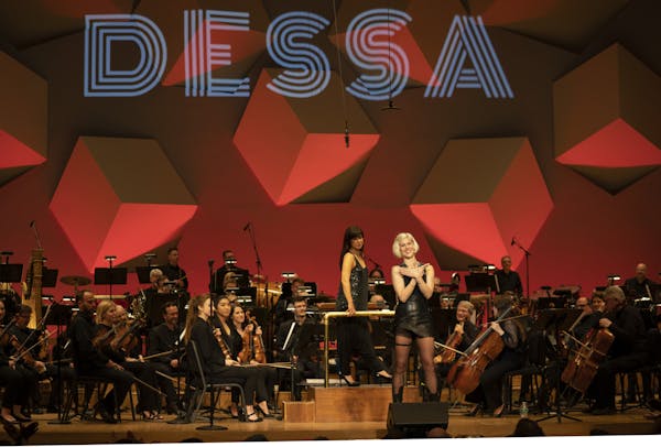 Dessa and the Minnesota Orchestra, conducted by Sarah Hicks, before they began their encore.