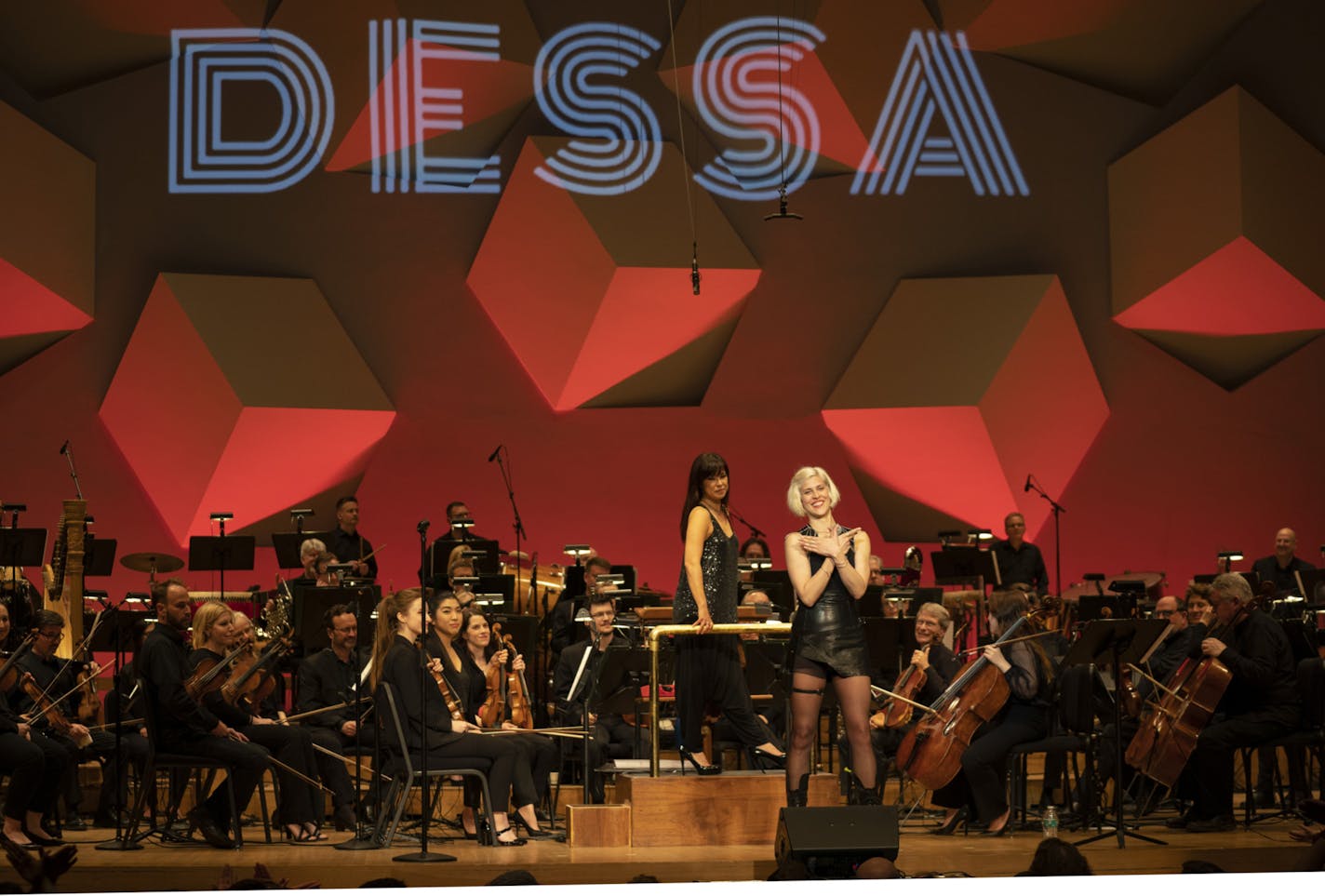 Dessa and the Minnesota Orchestra, conducted by Sarah Hicks, before they began their encore.