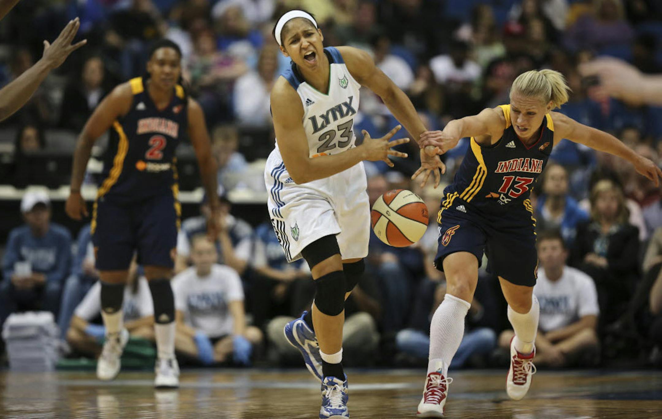 The Lynx's Maya Moore was blocked by Indiana's Erin Phillips as she grabbed for a pass in the second quarter.