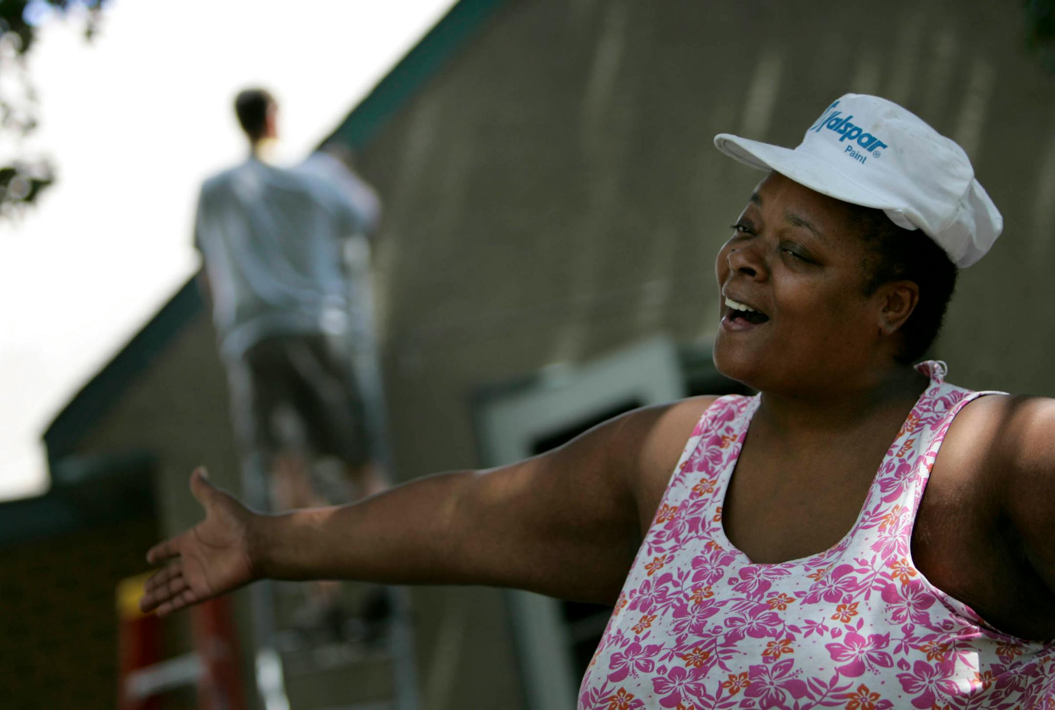 "I thank everybody," Smith said outside her North Side home, where a crew of 15 Cuningham Group volunteers worked on her home, including Scott Krenner of Plymouth, background.