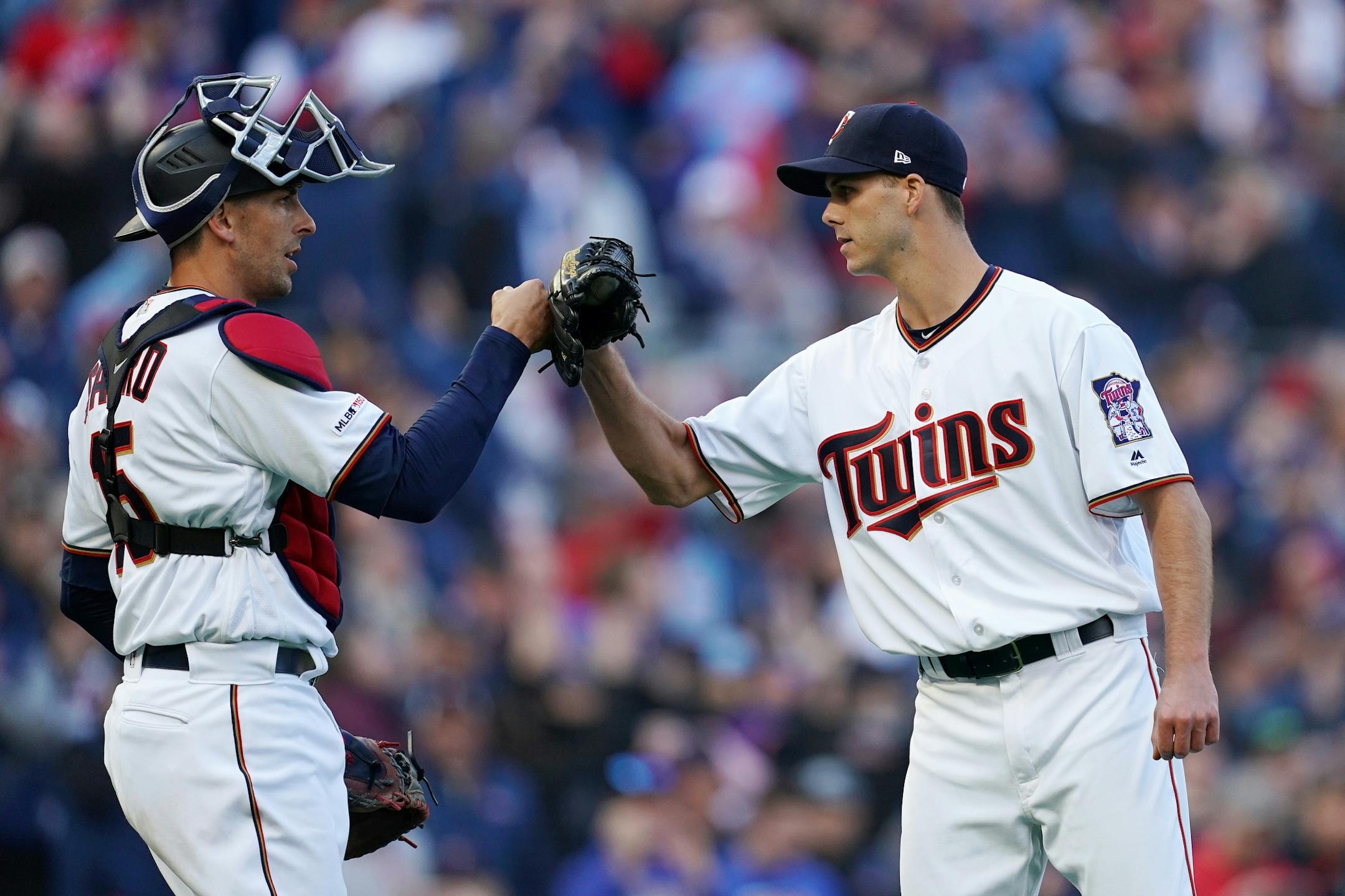 Minnesota Twins relief pitcher Taylor Rogers (55) celebrated with Minnesota Twins catcher Jason Castro (15) after getting the win Thursday.