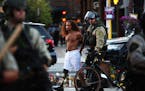 A protestor is arrested by Minneapolis police as they clear out barricades put up by protestors on W. Lake Street in Uptown on Tuesday, June 16, 2021,