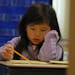Christina Yang, 6, focused on learning vocabulary at Mississippi Elementary School in Coon Rapids. The school has two ESL-certified teachers and 100 s