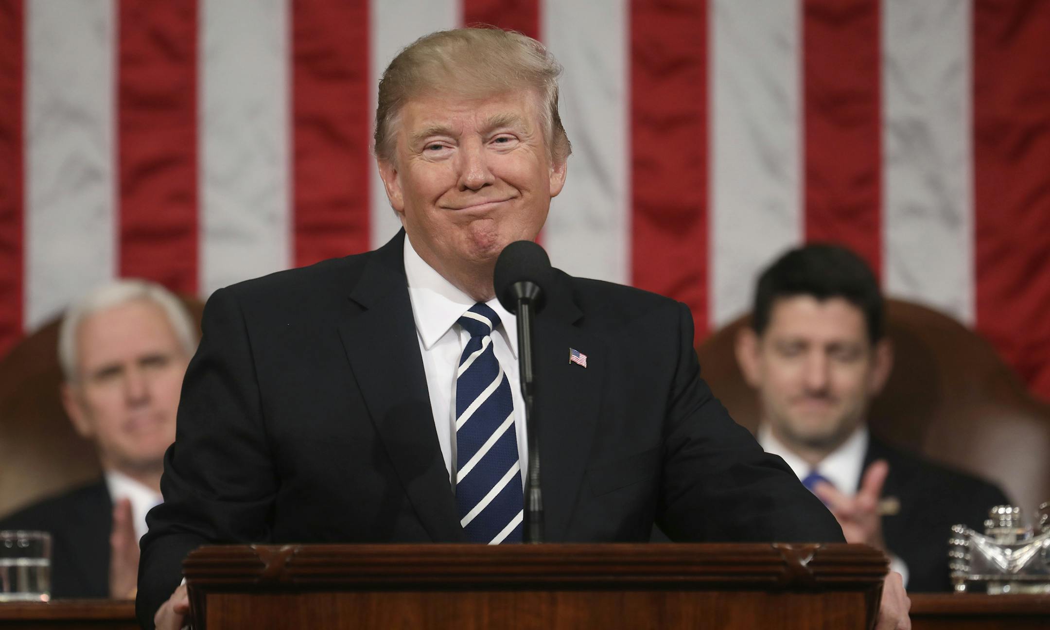 President Donald Trump addresses a joint session of Congress on Capitol Hill in Washington, Tuesday, Feb. 28, 2017, as Vice President Mike Pence and House Speaker Paul Ryan of Wis., listen. (Jim Lo Scalzo/Pool Image via AP)