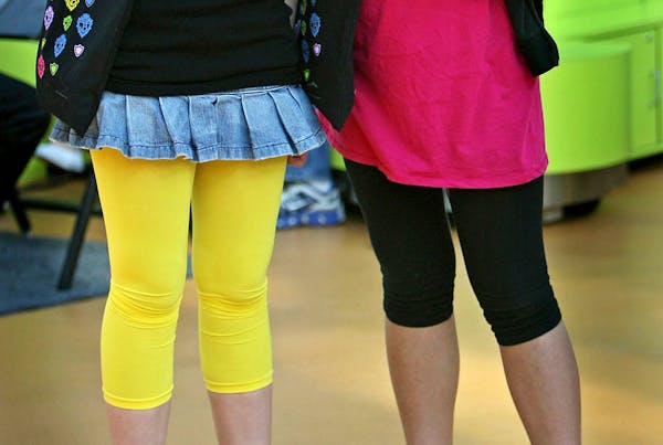 Leggings and yoga pants are usually worn with a long top covering the hips.